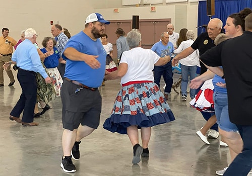 A varied group of people having fun dancing